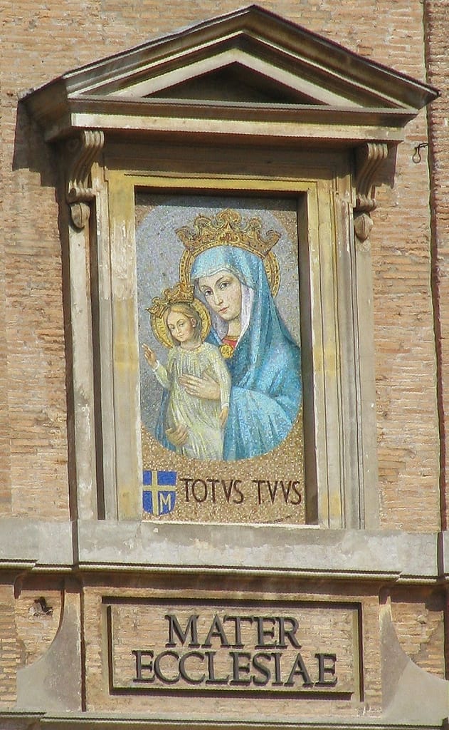 Mother of the Church. Mosaic of Mater Ecclesiae in St. Peter's Square. The mosaic bears the personal arms and motto of Pope John Paul II, who approved the installation of the image